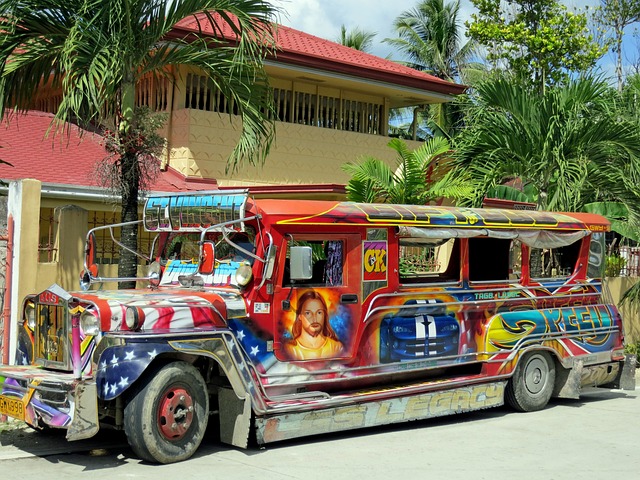A colorfully painted jeepney parked outside a building