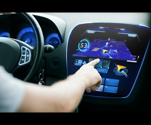 male hand using navigation system on car dashboard